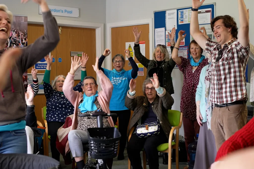 Parksinson's Centre for Integrated Therapy members enjoying a group sit down dance therapy class